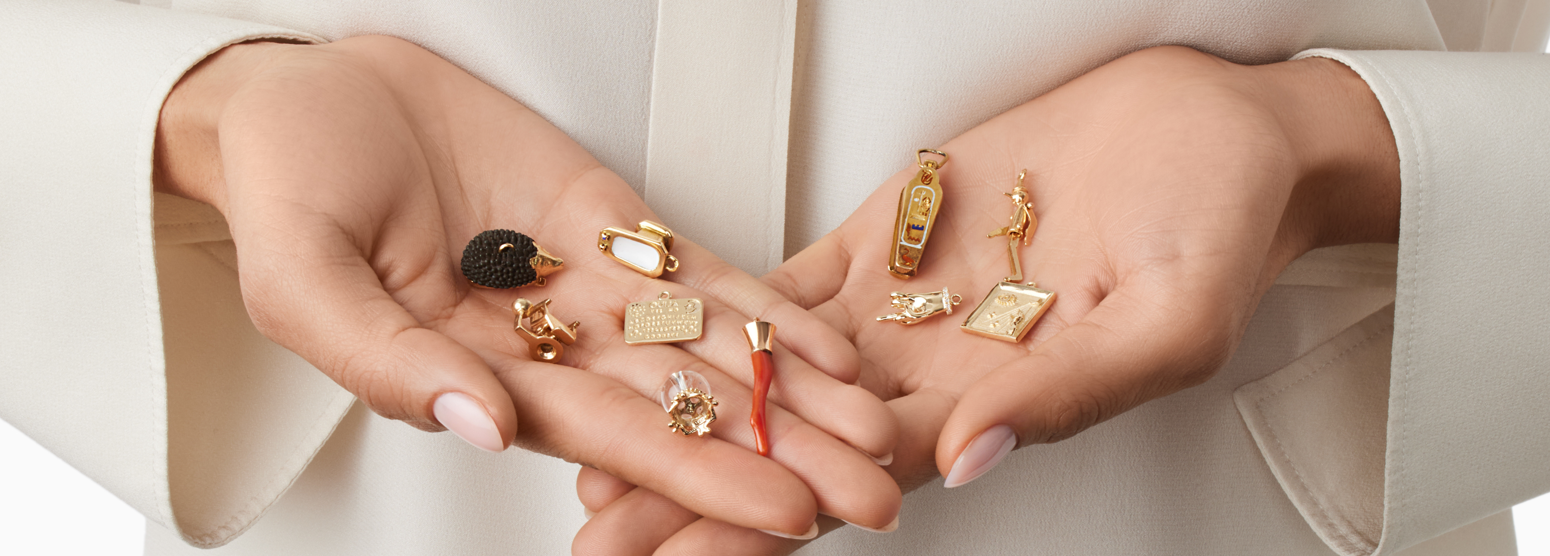 handful of unique gold charms